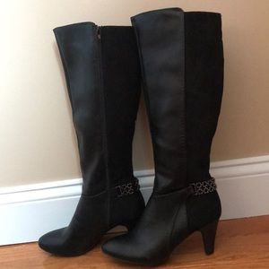 Tall black suede and leather boots.